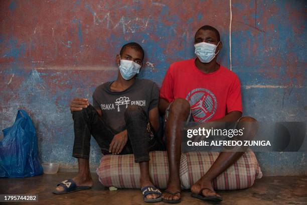 Inmates diagnosed with Tuberculosis sit on a mattress at an isolated cell in the maximum security prison of Maputo on November 6, 2023. A large pilot...