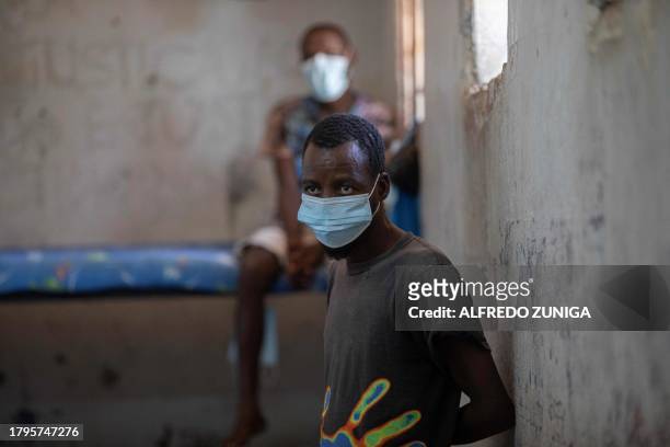 An inmate diagnosed with Tuberculosis look on at an isolated cell in the maximum security prison of Maputo on November 6, 2023. A large pilot of an...