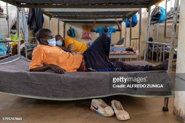 Inmates diagnosed with Tuberculosis rest on their beds at an isolated cell in the general prison of Maputo on November 6, 2023. A large pilot of an...