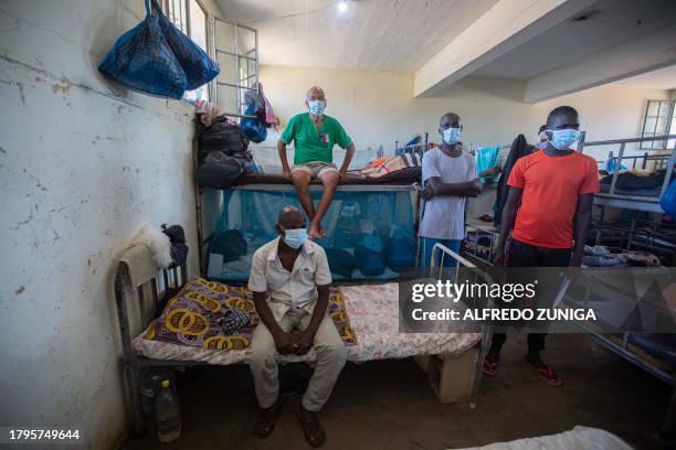 Inmates diagnosed with Tuberculosis gather at an isolated cell in the general prison of Maputo on November 6, 2023. A large pilot of an artificial...