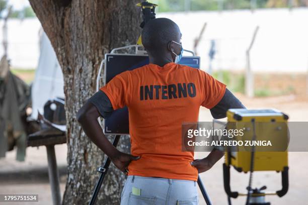 An inmate gets an X-ray scanner at the general prison in Maputo on November 6, 2023. A large pilot of an artificial intelligence programme that has...