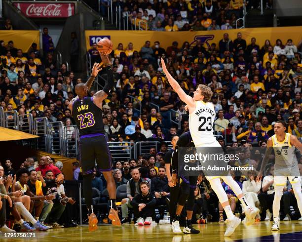 LeBron James of the Los Angeles Lakers shoots a three point basket during the game to reach 39,000 point milestone to during the in Season Tournament...