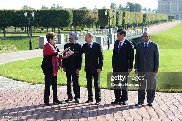 In this handout image provided by Host Photo Agency, President of Brazil Dilma Vana Rousseff, Prime Minister of India Manmohan Singh, President of...