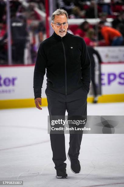 Head coach John Tortorella of the Philadelphia Flyers is seen between periods against the Carolina Hurricanes at PNC Arena on November 15, 2023 in...