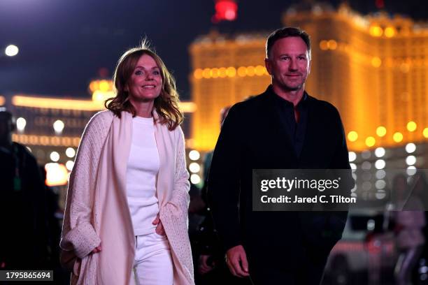 Red Bull Racing Team Principal Christian Horner and Geri Horner walk in the Paddock during previews ahead of the F1 Grand Prix of Las Vegas at Las...