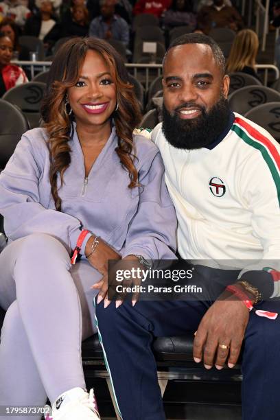 Kandi Burruss and Todd Tucker attend the game between the New York Knicks and the Atlanta Hawks at State Farm Arena on November 15, 2023 in Atlanta,...