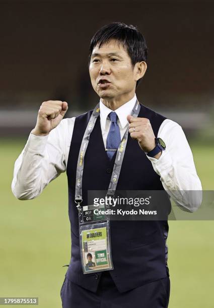Japan manager Hajime Moriyasu does a double fist pump after his team's victory over Syria in an Asian second-round qualifying match for the 2026...