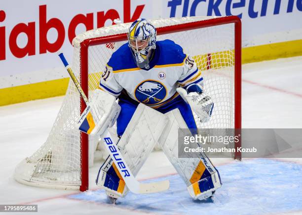 Goaltender Eric Comrie of the Buffalo Sabres guards the net during third period action against the Winnipeg Jets at Canada Life Centre on November...