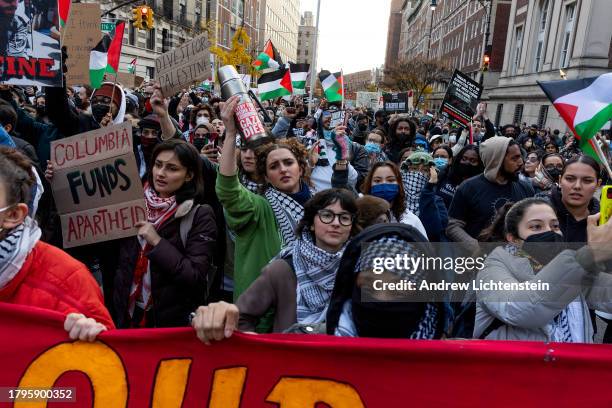 Pro Palestinian demonstrators march in solidarity with two Columbia University student groups which were recently banned from campus for their...