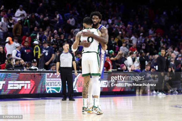 Joel Embiid of the Philadelphia 76ers and Jayson Tatum of the Boston Celtics embrace after the Celtics defeated the 76ers at the Wells Fargo Center...