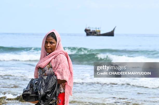 Newly-arrived Rohingya refugee stands on a beach in Sabang island, Aceh province on November 22, 2023.