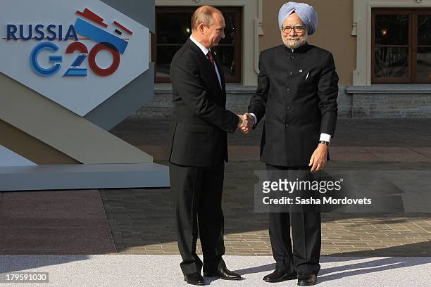 Russian President Vladimir Putin greets Indian President Manmohan Singh during the G20 summit on September 5, 2013 in St. Petersburg, Russia. The G20...