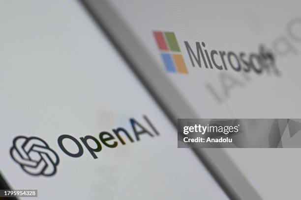 In this photo illustration, OpenAI logo is displayed on a mobile phone screen in front of the logo of Microsoft in Ankara, Turkiye on November 21,...