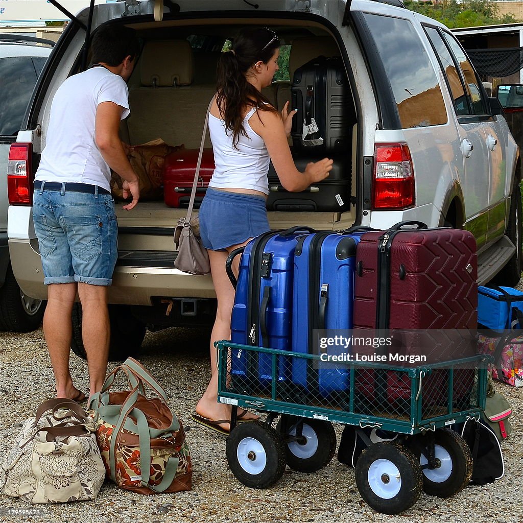 Loading luggage into car