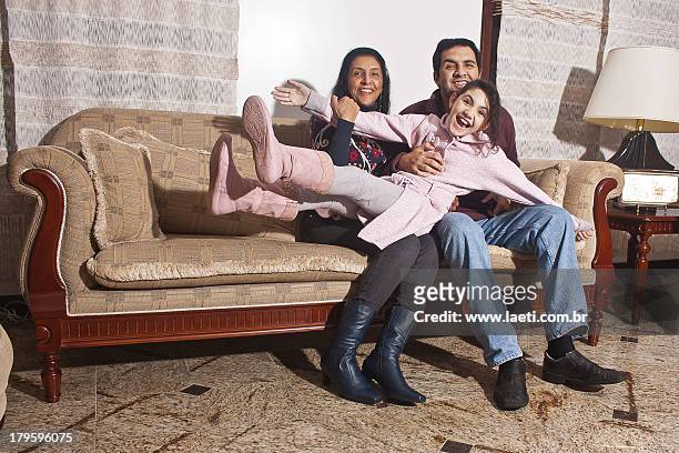 a family - familie sofa stock pictures, royalty-free photos & images