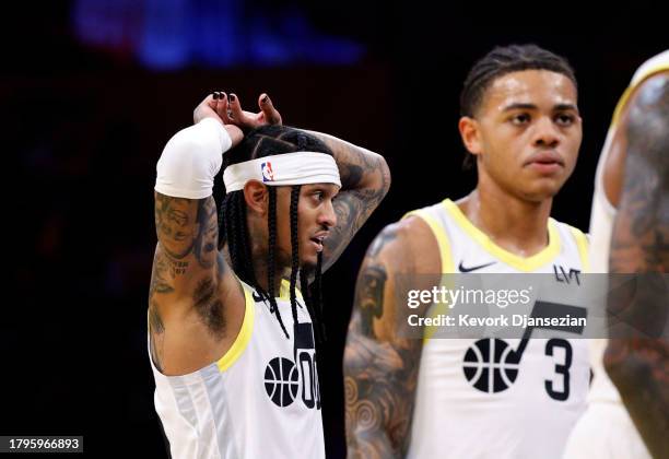 Jordan Clarkson of the Utah Jazz reacts after a foul by teammate Keyonte George of the Utah Jazz against the Los Angeles Lakers during the first half...