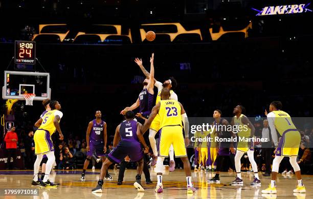 Domantas Sabonis of the Sacramento Kings and Anthony Davis of the Los Angeles Lakers on the opening tip in the first quarter at Crypto.com Arena on...