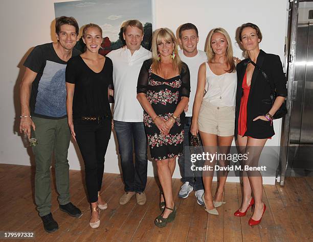 Jessie Wood, Beth Witson, Jamie Wood, Jo Wood, Tyrone Wood, Jodie Wood and Leah Wood attend the VIP launch of the 'Hand To Earth' exhibition hosted...