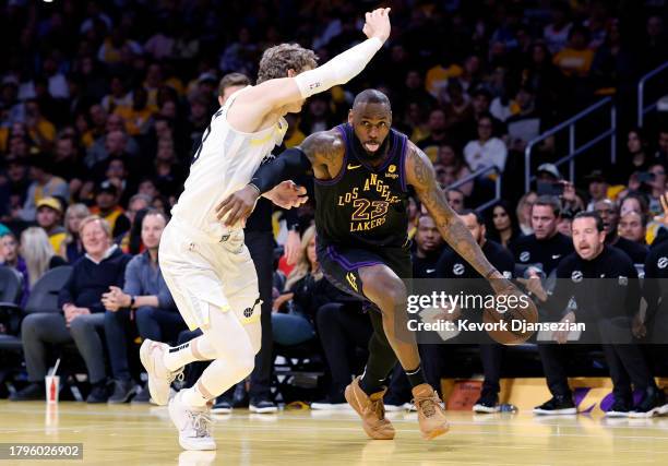 LeBron James of the Los Angeles Lakers drives to the basket against Lauri Markkanen of the Utah Jazz during the first half of an NBA In-Season...