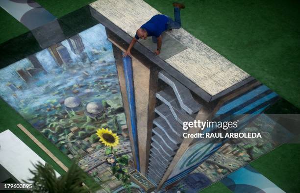 Man poses by the work of British artist Julian Beever, specialized in pavement drawings, wall murals and realistic paintings, made in a shopping...