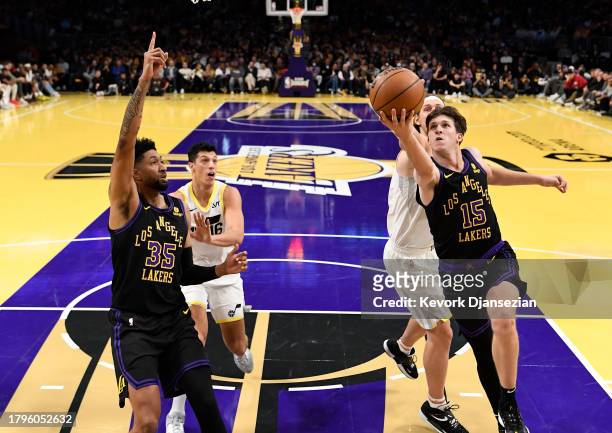 Austin Reaves of the Los Angeles Lakers scores a basket against Lauri Markkanen of the Utah Jazz during the second half of an NBA In-Season...