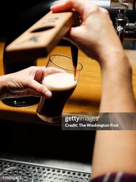 October 29, 2023: Bartender and certified LUKR tapster Robin Fowler demonstrates a nitro pour with their stout "Standard Deviation" at Wild East...