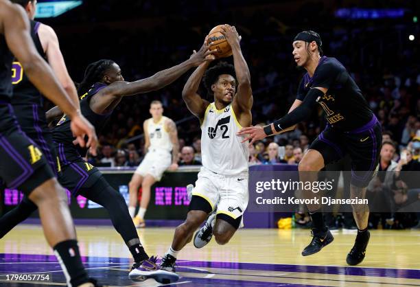 Collin Sexton of the Utah Jazz drives to basket as he is double teamed by Taurean Prince and Jaxson Hayes of the Los Angeles Lakers during the second...