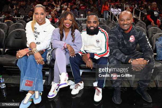 Kimberly Blackwell, Kandi Burruss, Todd Tucker, and Big Tigger attend the game between the New York Knicks and the Atlanta Hawks at State Farm Arena...