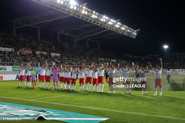 Nagoya Grampus players applaud fans after the team's 1-0 victory in the J.League J1 second stage match between Matsumoto Yamaga and Nagoya Grampus at...