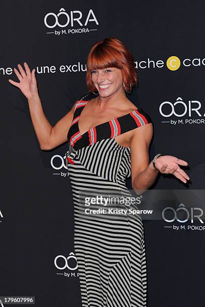 Fauve Hautot attends the photocall for 'OORA' Womenswear Collection designed by French singer Matt Pokora at Pavillon Gabriel on September 5, 2013 in...