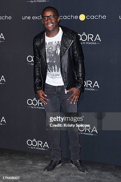 Rio Mavuba attends the photocall for 'OORA' Womenswear Collection designed by French singer Matt Pokora at Pavillon Gabriel on September 5, 2013 in...