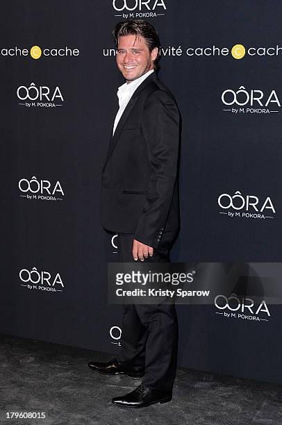 Julien Dassin attends the photocall for 'OORA' Womenswear Collection designed by French singer Matt Pokora at Pavillon Gabriel on September 5, 2013...
