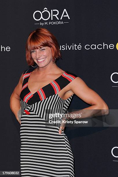 Fauve Hautot attends the photocall for 'OORA' Womenswear Collection designed by French singer Matt Pokora at Pavillon Gabriel on September 5, 2013 in...