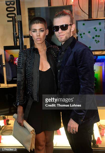 Singer Alina Sueggeler and Andi Weizel of band 'Frida Gold' attend the opening of the Diesel flagship store on September 5, 2013 in Frankfurt am...