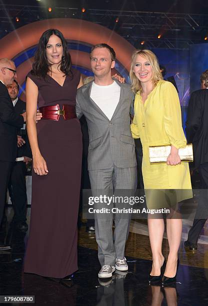 Bettina Zimmermann, Ralf Schmitz and Anna Maria Muehe attend "Deutscher Radiopreis" at Schuppen 52 on September 5, 2013 in Hamburg, Germany.