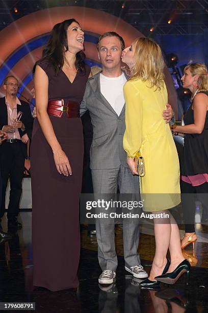 Bettina Zimmermann, Ralf Schmitz and Anna Maria Muehe attend "Deutscher Radiopreis" at Schuppen 52 on September 5, 2013 in Hamburg, Germany.