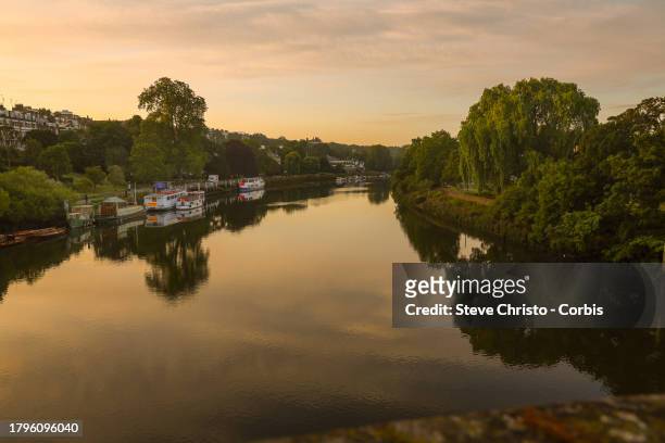 View of the River Thames at sunset from the Richmond Bridge in Richmond, on July 18 in London, United Kingdom.