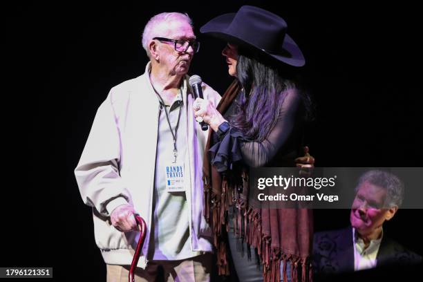 Billy Blythe and Mary Travis speak during A Texas Heroes & Friends Tribute to Randy Travis - 1 Night, 1 Place, 1 Time at Texas Trust CU Theatre on...