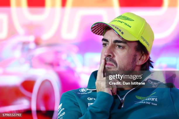 Fernando Alonso of Spain and Aston Martin F1 Team looks on in the Drivers Press Conference during previews ahead of the F1 Grand Prix of Las Vegas at...