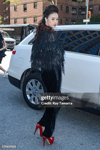 Actress Jiang Xin enters Mercedes-Benz Fashion Week at Lincoln Center on September 5, 2013 in New York City.