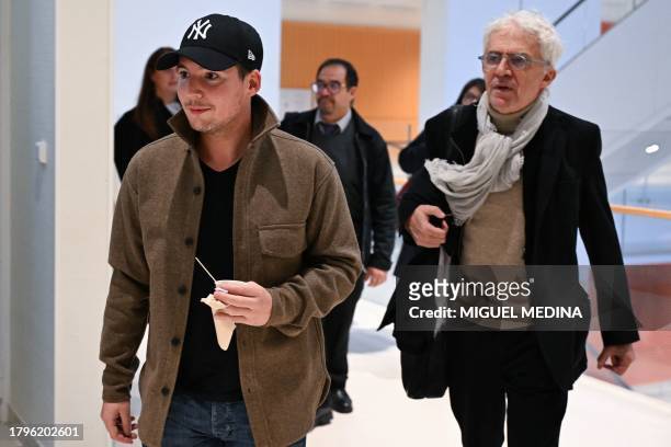 Portuguese whistleblower and founder of "Football Leaks" Rui Pinto flanked by his lawyer William Bourdon arrives at the courthouse to face trial for...