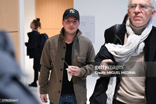 Portuguese whistleblower and founder of "Football Leaks" Rui Pinto flanked by his lawyer William Bourdon arrives at the courthouse to face trial for...
