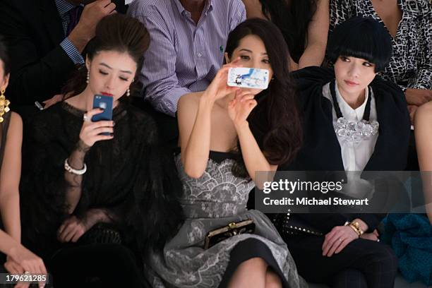 Actresses Jiang Xin, Zeng Li and Liu Mei Ren attend the Tadashi Shoji show during Spring 2014 Mercedes-Benz Fashion Week at The Stage at Lincoln...