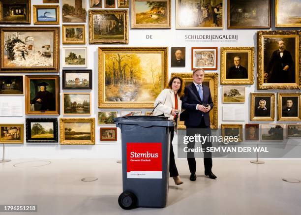 Leader of the New Social Contract Pieter Omtzigt and his wife Ayfer Koç pose after voting for the general elections at a polling station in Enschede...