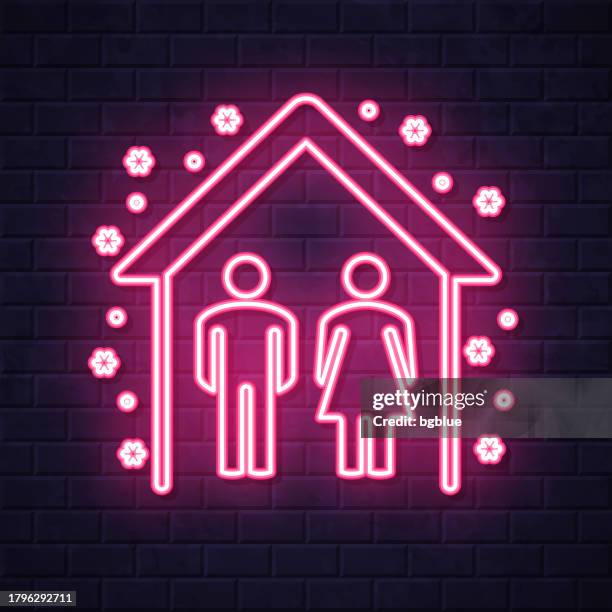 stay home, stay safe. glowing neon icon on brick wall background - brick wall interior stock illustrations