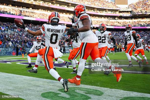 Greg Newsome II of the Cleveland Browns celebrates after returning an interception for a touchdown during the second half against the Baltimore...