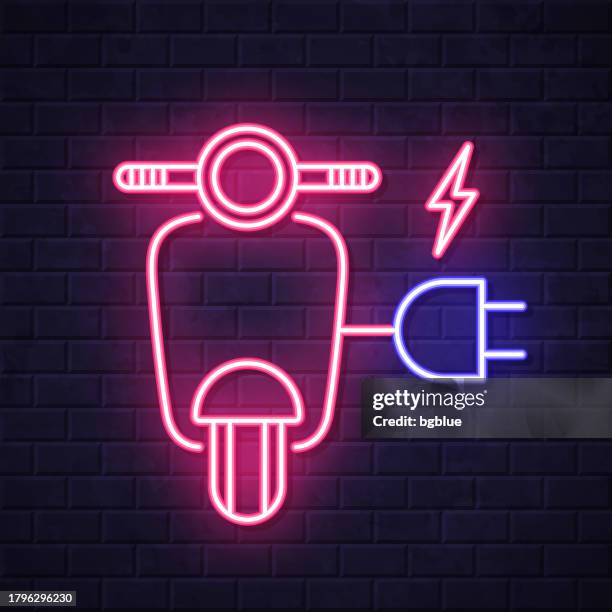 electric scooter motorcycle with plug. glowing neon icon on brick wall background - red electrical wire stock illustrations