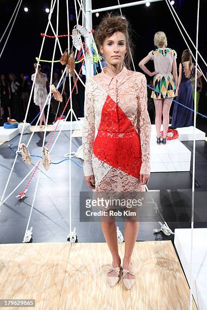 Models pose at the Candela presentation during Spring 2014 Mercedes-Benz Fashion Week at The Box at Lincoln Center on September 5, 2013 in New York...