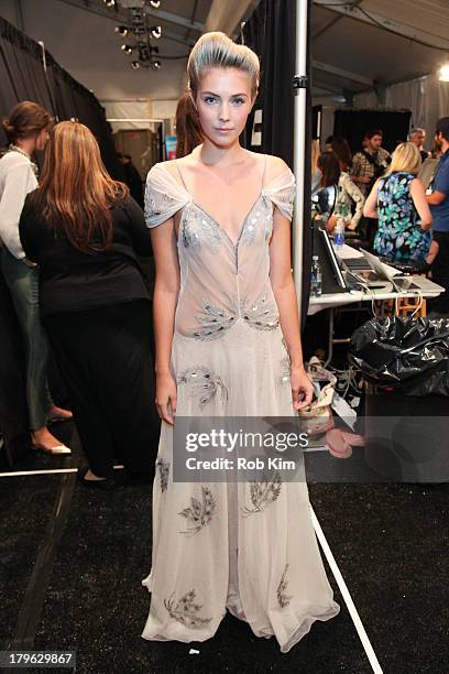 Models backstage at hair and makeup at the Candela presentation during Spring 2014 Mercedes-Benz Fashion Week at The Box at Lincoln Center on...