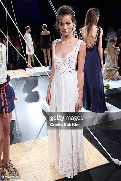 Models pose at the Candela presentation during Spring 2014 Mercedes-Benz Fashion Week at The Box at Lincoln Center on September 5, 2013 in New York...